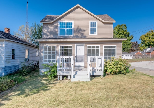 exterior space with a front yard and a deck