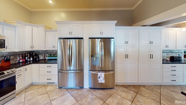10922 N Lower Lakeshore Dr, Monticello, IN 47960 - kitchen featuring white cabinetry, dark countertops, stainless steel appliances, and crown molding
