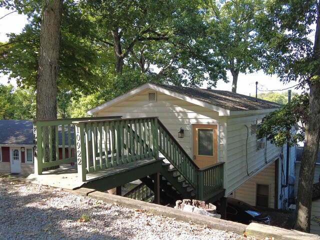 view of home's exterior with a wooden deck