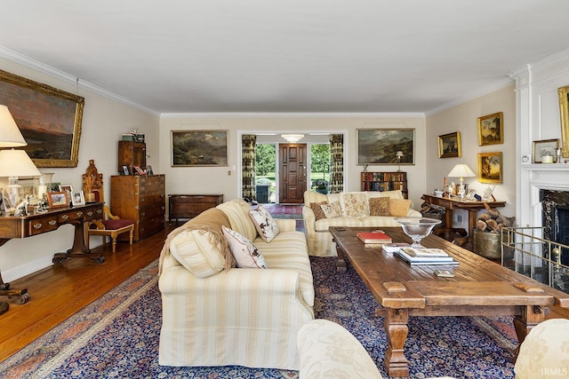 living room with a fireplace, ornamental molding, and dark hardwood / wood-style floors