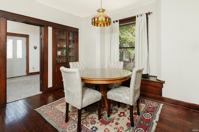 dining area featuring dark hardwood / wood-style flooring