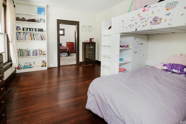 bedroom featuring dark wood-type flooring