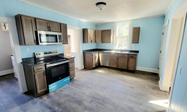 kitchen featuring stainless steel appliances, sink, and crown molding