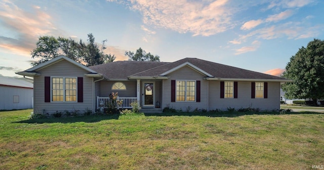 ranch-style house with a yard