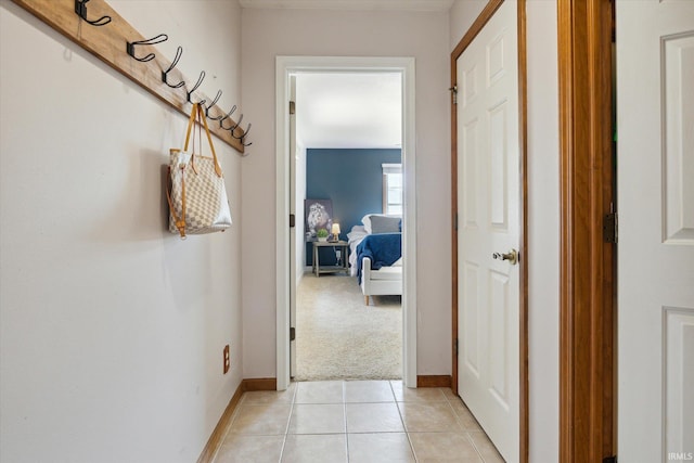 corridor with light colored carpet