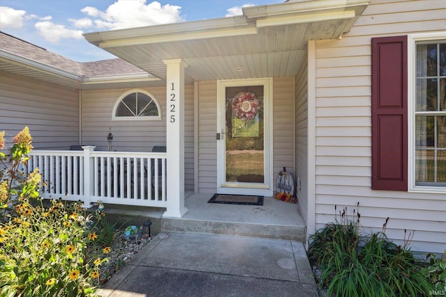 doorway to property featuring covered porch