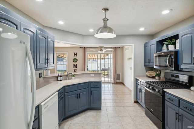 kitchen with blue cabinets, black gas stove, dishwasher, and fridge