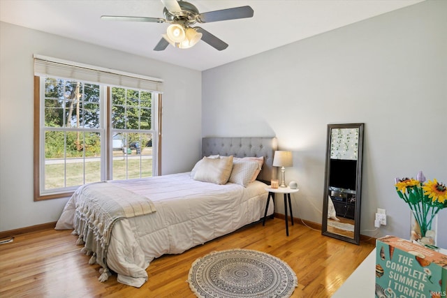 bedroom featuring light hardwood / wood-style floors and ceiling fan