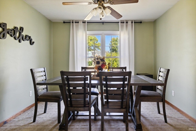 dining area featuring carpet floors and ceiling fan