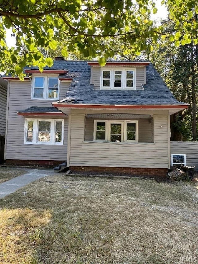 1243 Portage Ave, South Bend, IN 46616 - view of front facade featuring a shingled roof