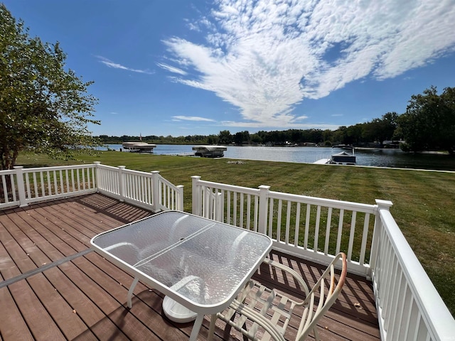 wooden terrace featuring a yard and a water view