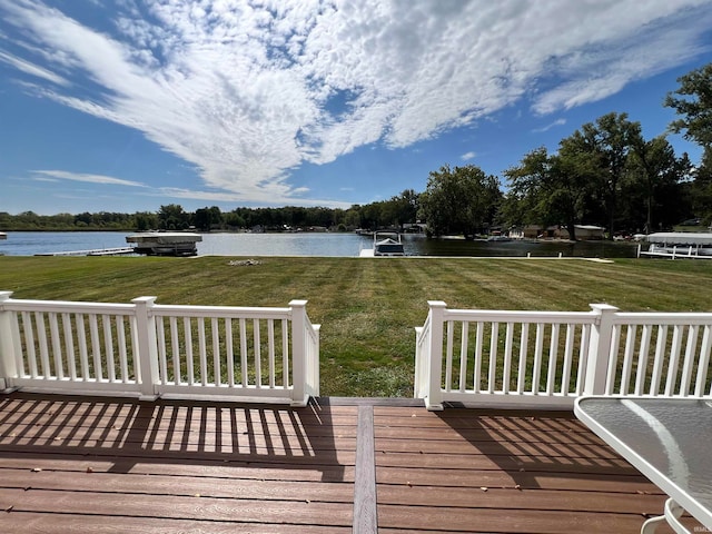 wooden terrace featuring a water view