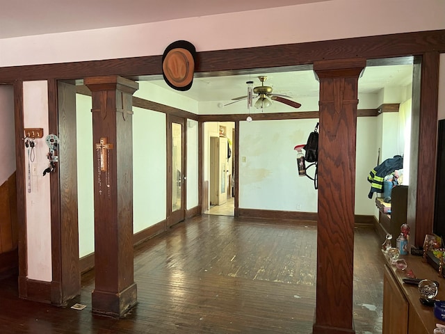 interior space featuring ceiling fan and dark wood-type flooring