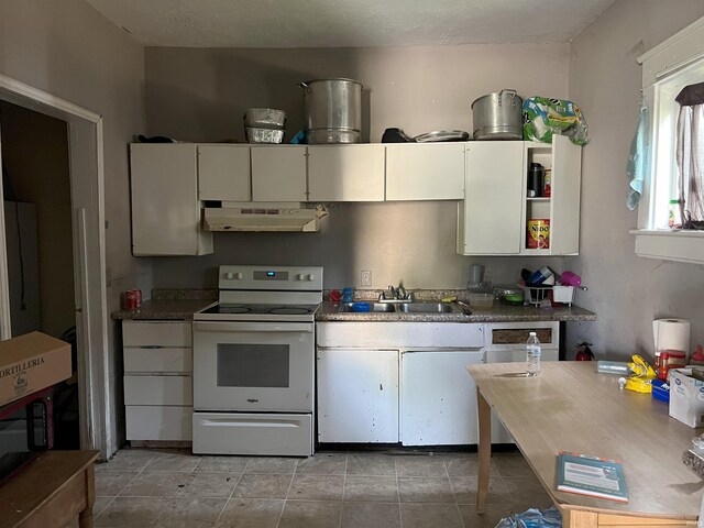 kitchen featuring white cabinets, white range with electric cooktop, and sink