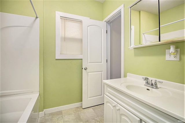 bathroom featuring shower / washtub combination, tile patterned flooring, and vanity