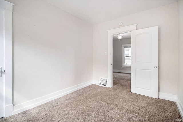 spare room with carpet floors