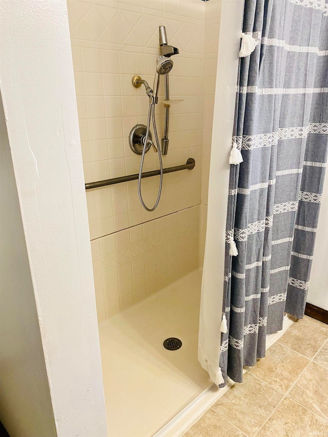 bathroom featuring tile patterned floors and a shower with curtain