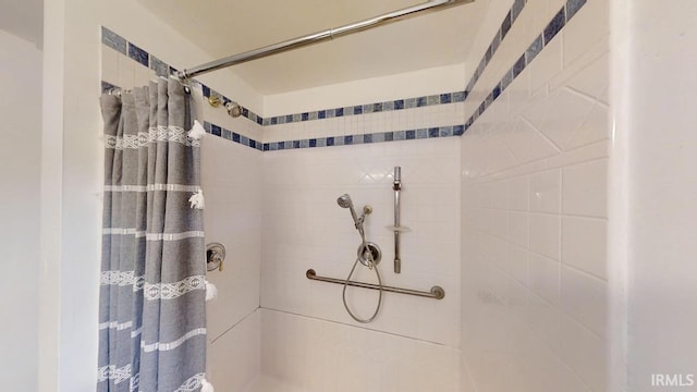 bathroom with a shower with curtain