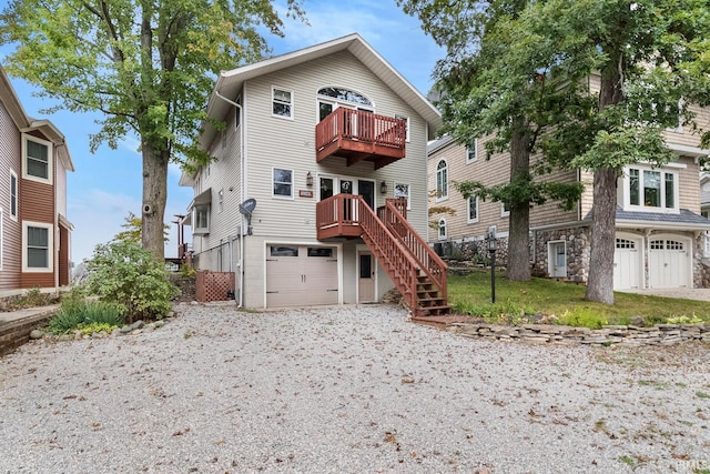 view of front facade with a balcony and a garage