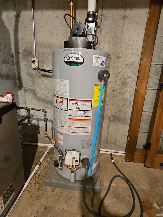 utility room featuring gas water heater