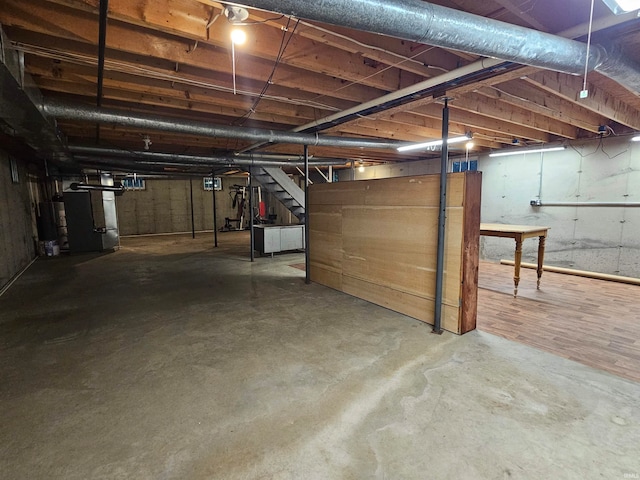 basement with gas water heater and heating unit