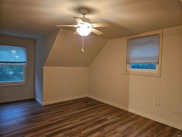 bonus room with lofted ceiling, dark hardwood / wood-style floors, and ceiling fan