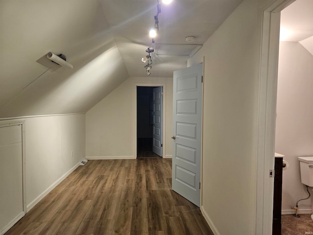 additional living space with lofted ceiling and hardwood / wood-style floors