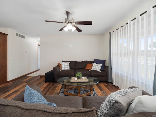 living room with ceiling fan and dark hardwood / wood-style floors