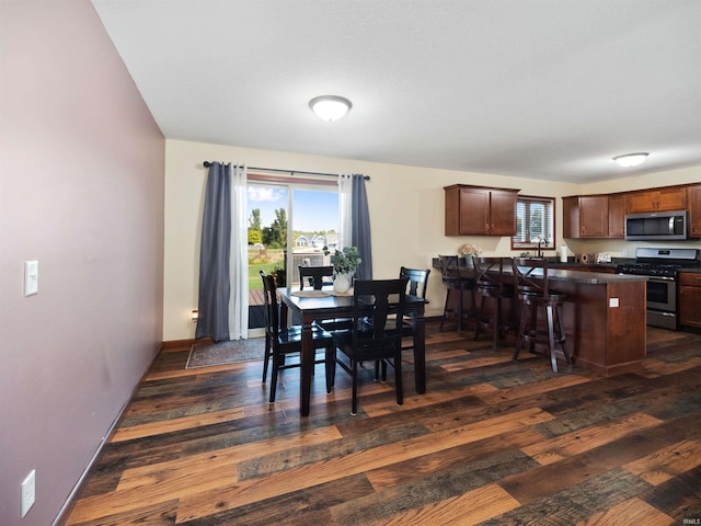 dining room with dark hardwood / wood-style floors