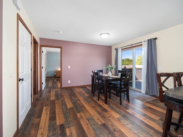 dining space featuring dark hardwood / wood-style flooring