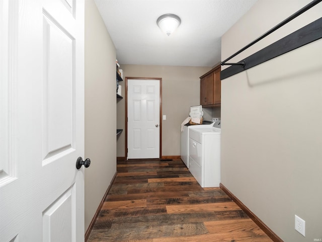 washroom featuring cabinets, dark hardwood / wood-style floors, and independent washer and dryer