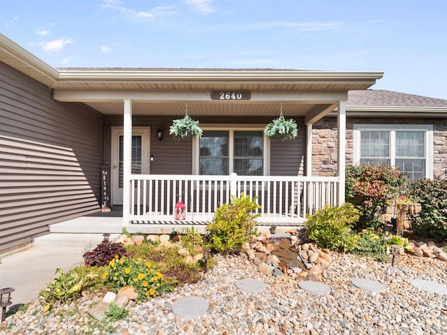 doorway to property featuring covered porch