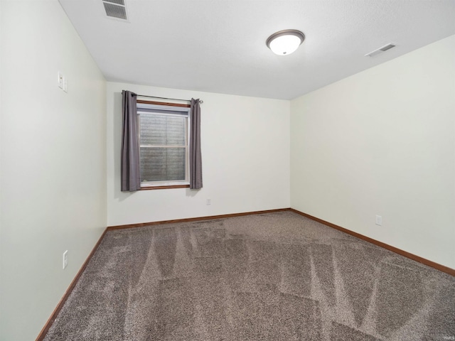 empty room featuring carpet flooring