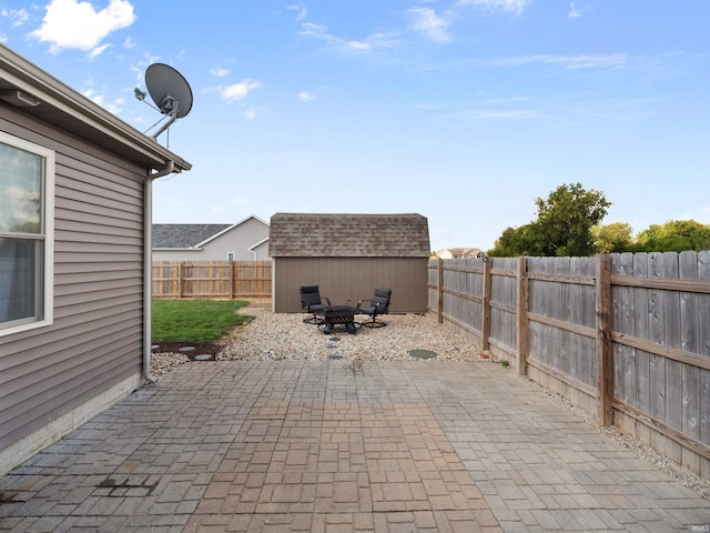 view of patio with a shed