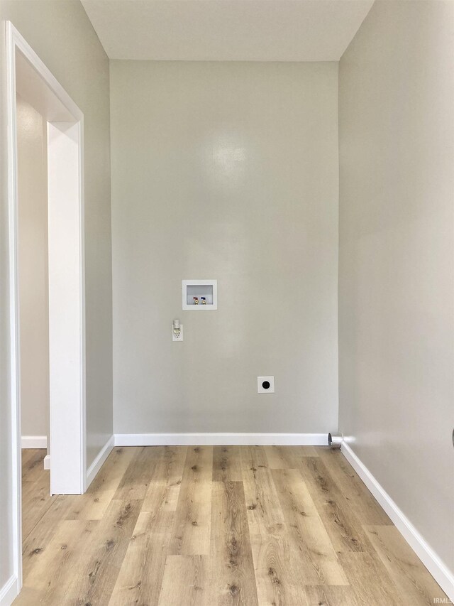 laundry room with washer hookup, light hardwood / wood-style floors, and electric dryer hookup