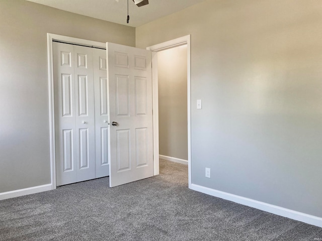 unfurnished bedroom featuring carpet and a closet