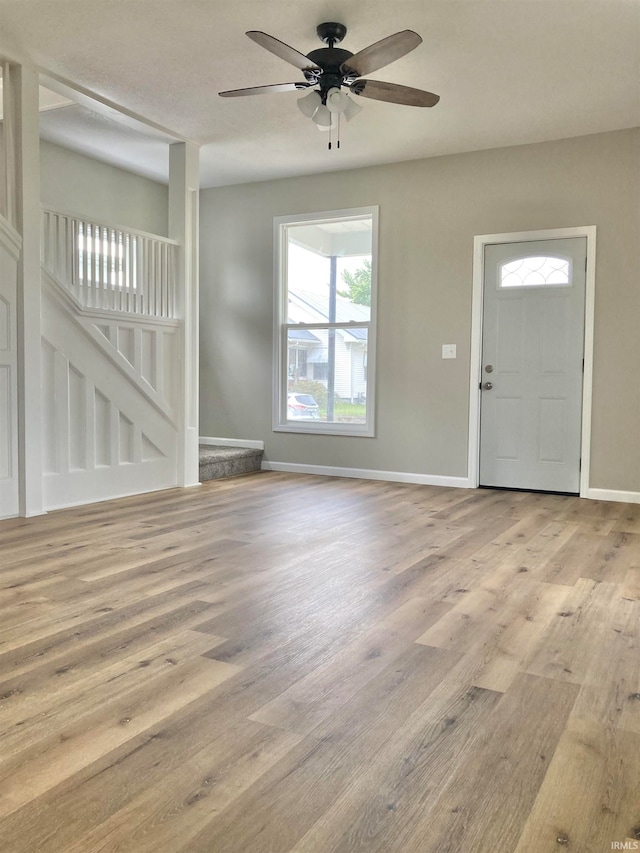 foyer featuring light hardwood / wood-style flooring and ceiling fan