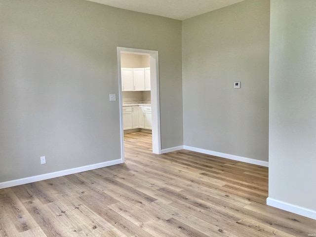 unfurnished room with light hardwood / wood-style flooring