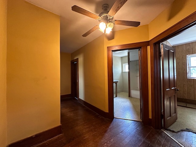 spare room featuring dark hardwood / wood-style floors and ceiling fan