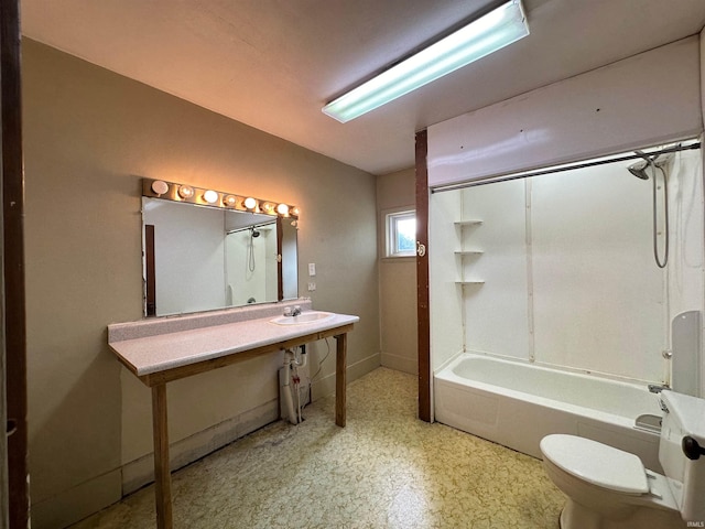 full bathroom featuring sink, shower / bath combination, and toilet