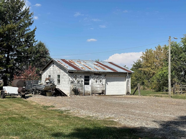 garage featuring a yard