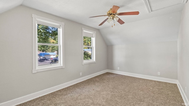 bonus room featuring carpet flooring, vaulted ceiling, and a wealth of natural light