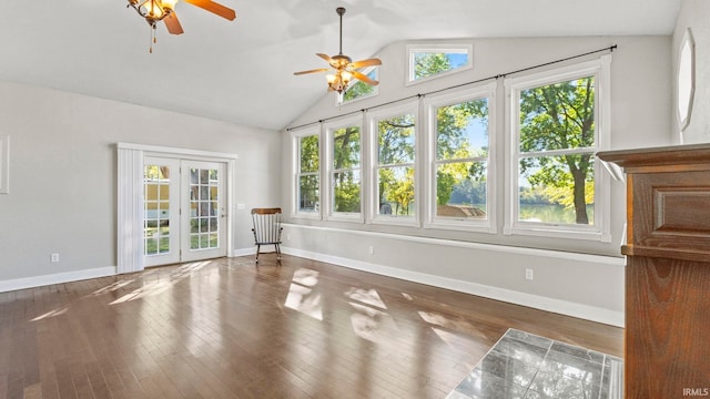 interior space with ceiling fan, lofted ceiling, french doors, and dark hardwood / wood-style flooring