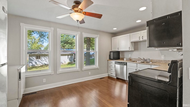 kitchen featuring ceiling fan, white cabinets, sink, stainless steel dishwasher, and dark wood-type flooring