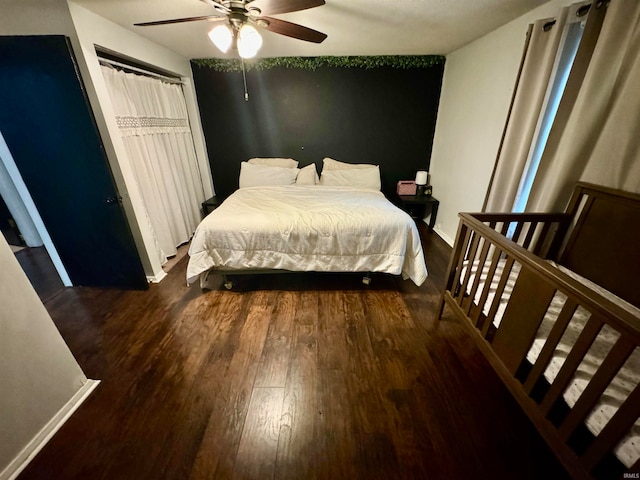 bedroom featuring ceiling fan and dark hardwood / wood-style floors