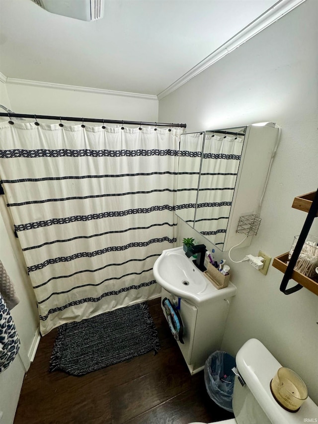 bathroom featuring walk in shower, ornamental molding, toilet, and hardwood / wood-style flooring