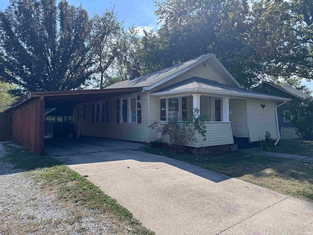 ranch-style home with a carport