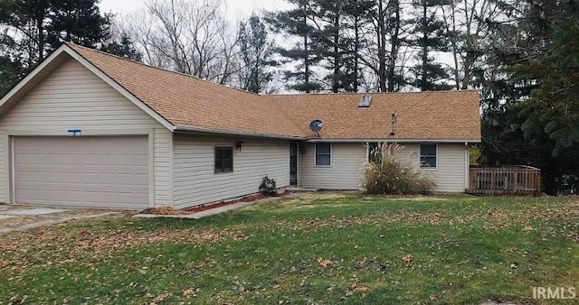 ranch-style house with a front lawn and a garage