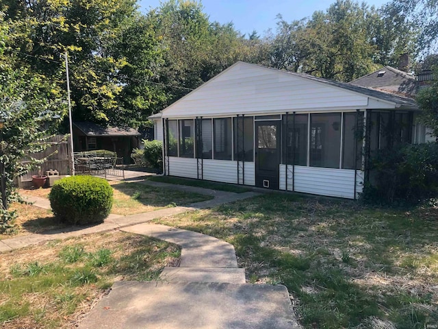 view of yard featuring a sunroom