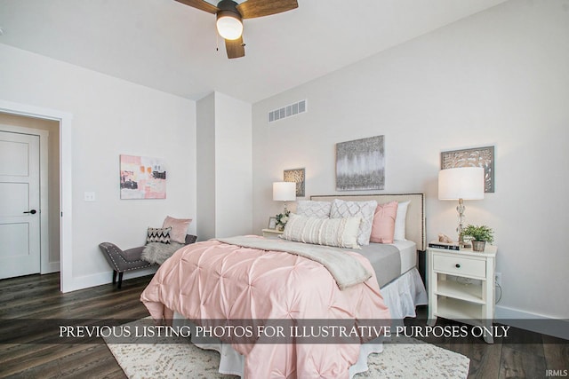 bedroom with dark hardwood / wood-style floors and ceiling fan